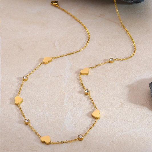 Elegante set collana e bracciale in oro 18 carati placcato con zirconi cubici a forma di cuore, catena in acciaio inossidabile e titanio per donne