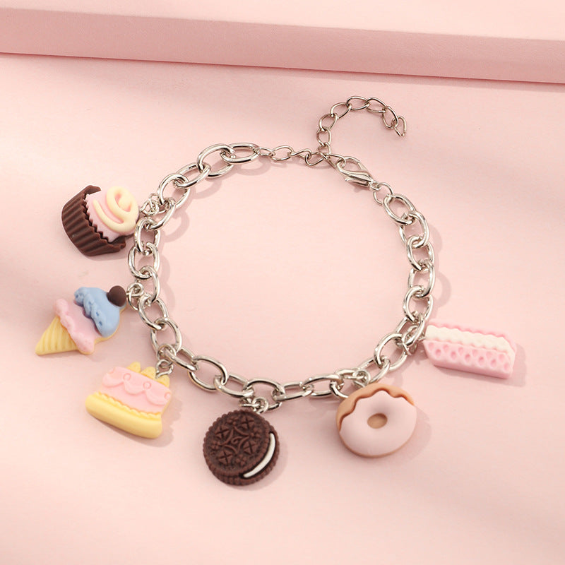 Pulsera de resina con colgante geométrico estilo punk para niñas, con cadena gruesa y borla.