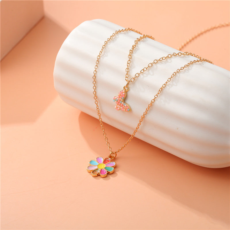 Collana con Ciondolo Girasole Cartone Animato per Bambini, Collana Multistrato a Farfalla in Lega con Finitura Smaltata e Catena a Croce