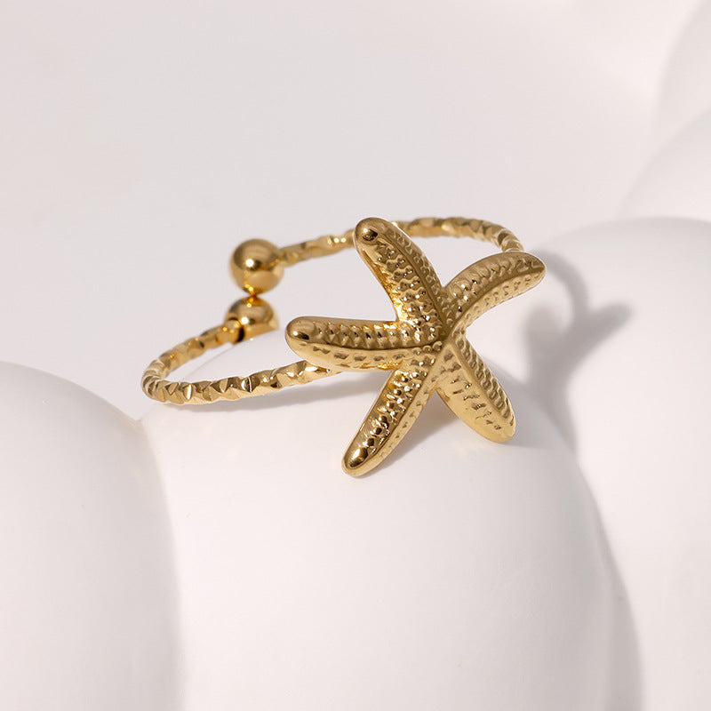 Anello aperto a stella marina minimalista in acciaio inossidabile da donna con finitura placcata
