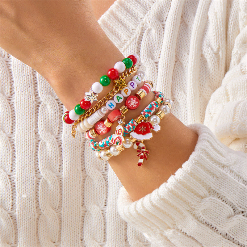 Pulsera minimalista con temática navideña con diseño de Papá Noel, bastón, muñeco de nieve, cuentas con letras y dije de aleación
