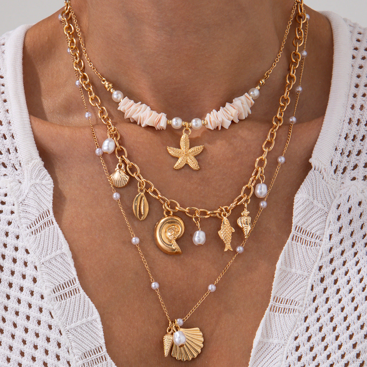 Collana con ciondolo a stella marina e conchiglia in stile vacanza con charm in lega e perle simulate su delicata catena per clavicola