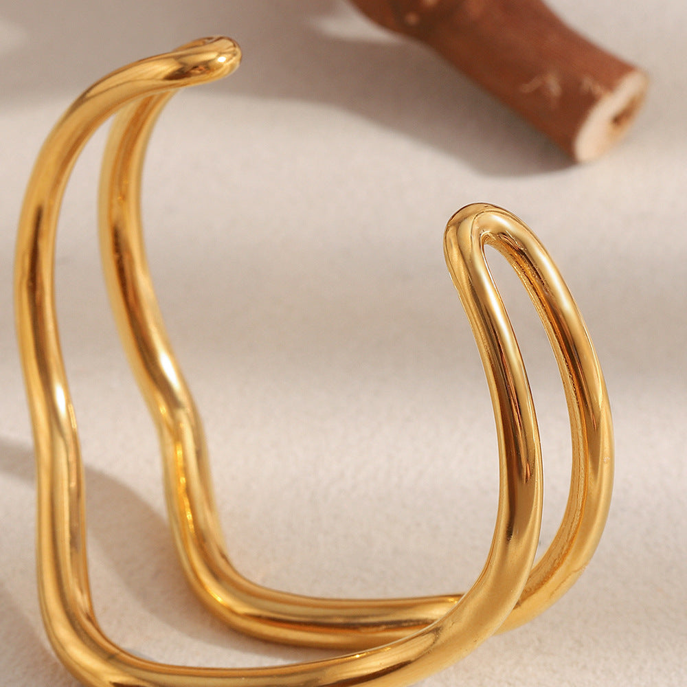 Minimalist Twisted Line Stainless Steel Bracelet for Women with 18K Gold Plating