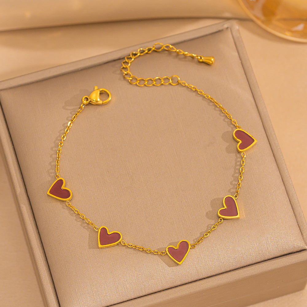 Pulsera minimalista de lujo ligero con forma de corazón de acero de titanio con PVD y oro blanco de 18 quilates y nácar para mujer