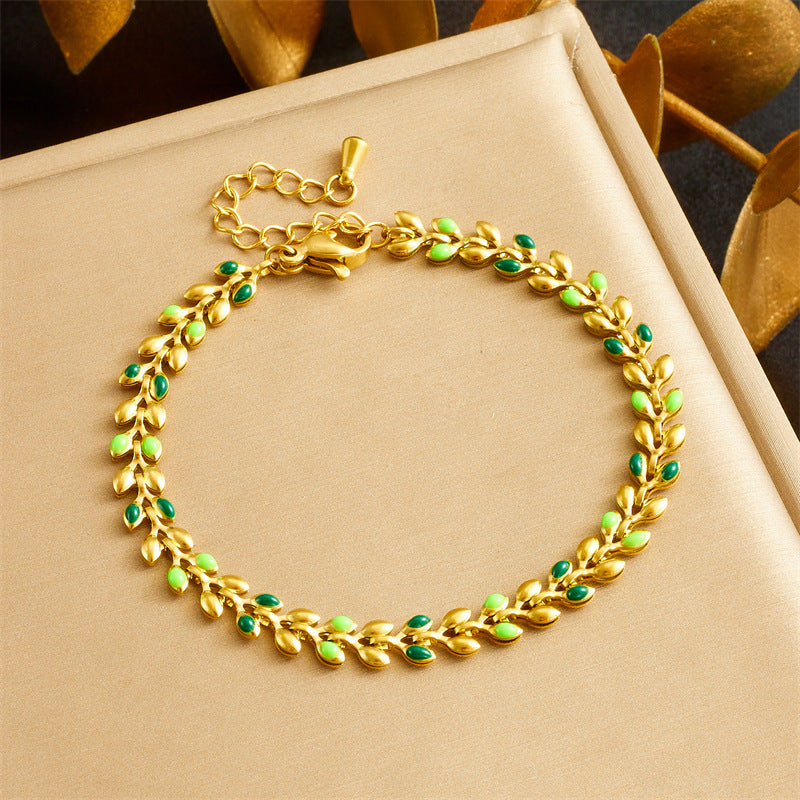 Bracciale da donna placcato oro minimalista in acciaio inossidabile con charm a foglia