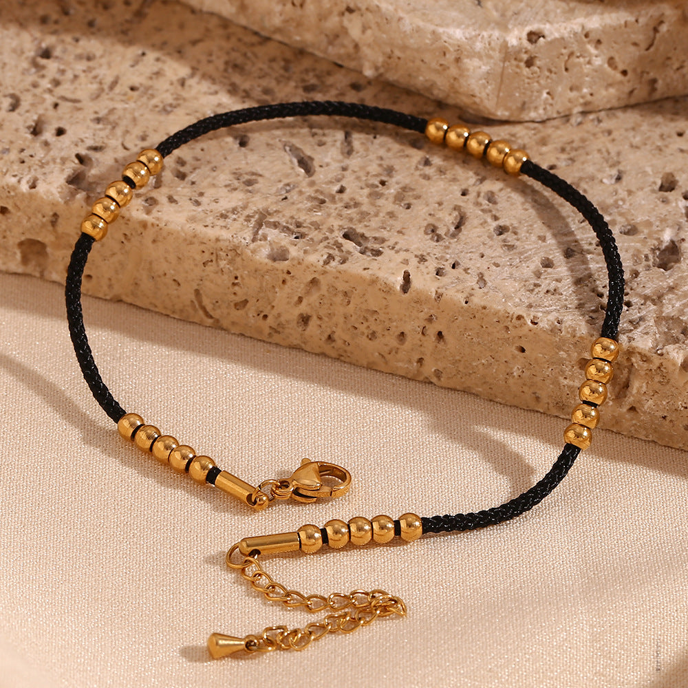 Minimalist Geometric Stainless Steel Anklet with 18K Gold Plating and Black Cord Accented with 25 Steel Beads
