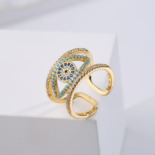Anillo Minimalista Geométrico de Ojo Turco Calado para Mujer con Base de Cobre y Baño de Oro con Circonitas Microengastadas