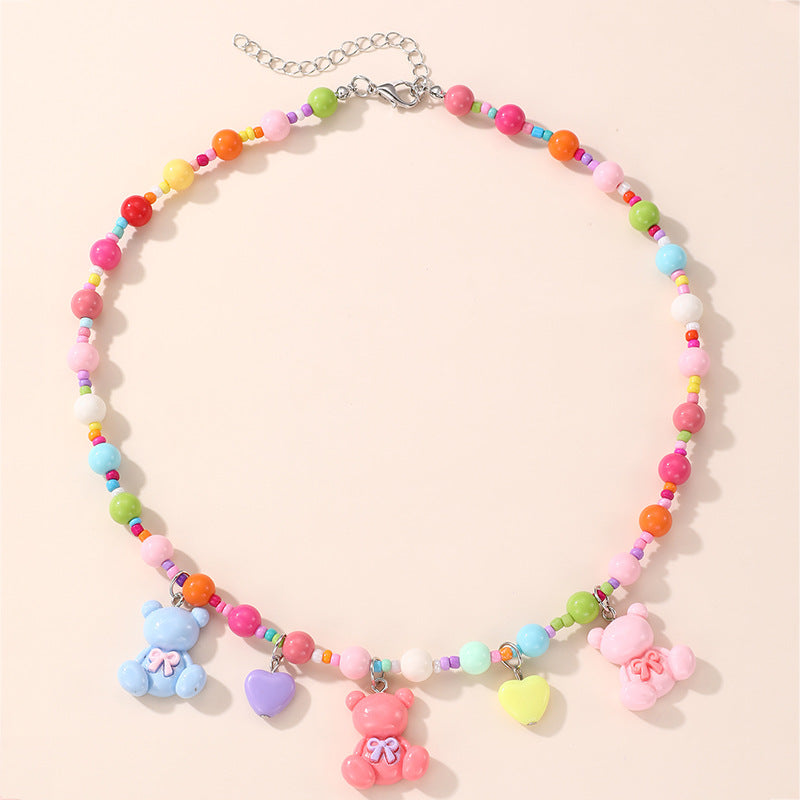 Collana con ciondolo a fiocco dolce pastello per ragazze con ciondolo in resina su catena a O, gioielli in stile cartone animato