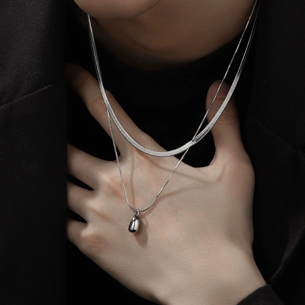 Collar minimalista de doble capa con colgante de lágrima en acero inoxidable con acabado pulido y cadena de serpiente, unisex