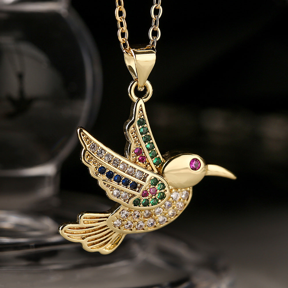 Collana con ciondolo a forma di uccello minimalista in rame placcato oro con zirconi per donna