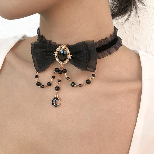 Sweet and Edgy Geometric Bow Knot Necklace with Alloy Base, Imitation Pearl Pendant, and Star-Moon Accents for Women