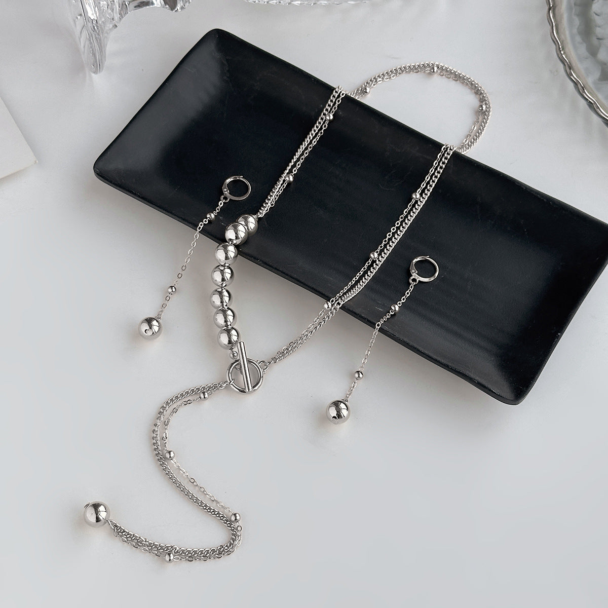Collana a Y asimmetrica con ciondolo a nappa e catena in metallo, in stile business, da donna