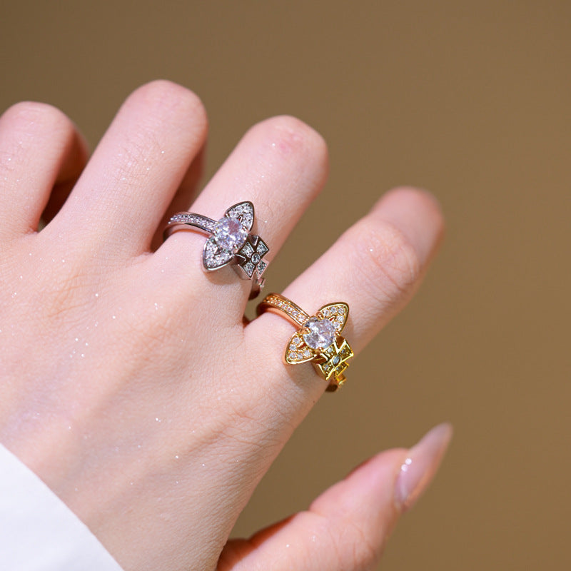 Anello lusso da donna regolabile a forma di Saturno con zirconi incastonati, in rame placcato oro e design geometrico minimalista