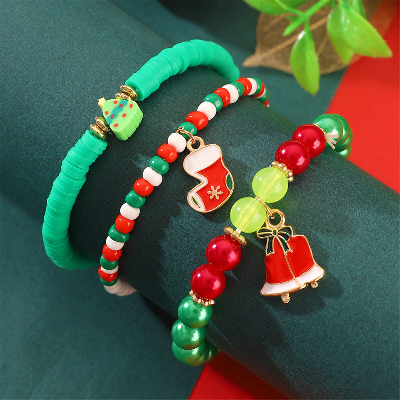 Set di bracciali natalizi fatti a mano in argilla polimerica da donna con ciondoli di Babbo Natale e fiocchi di neve in stile cartone animato giocoso