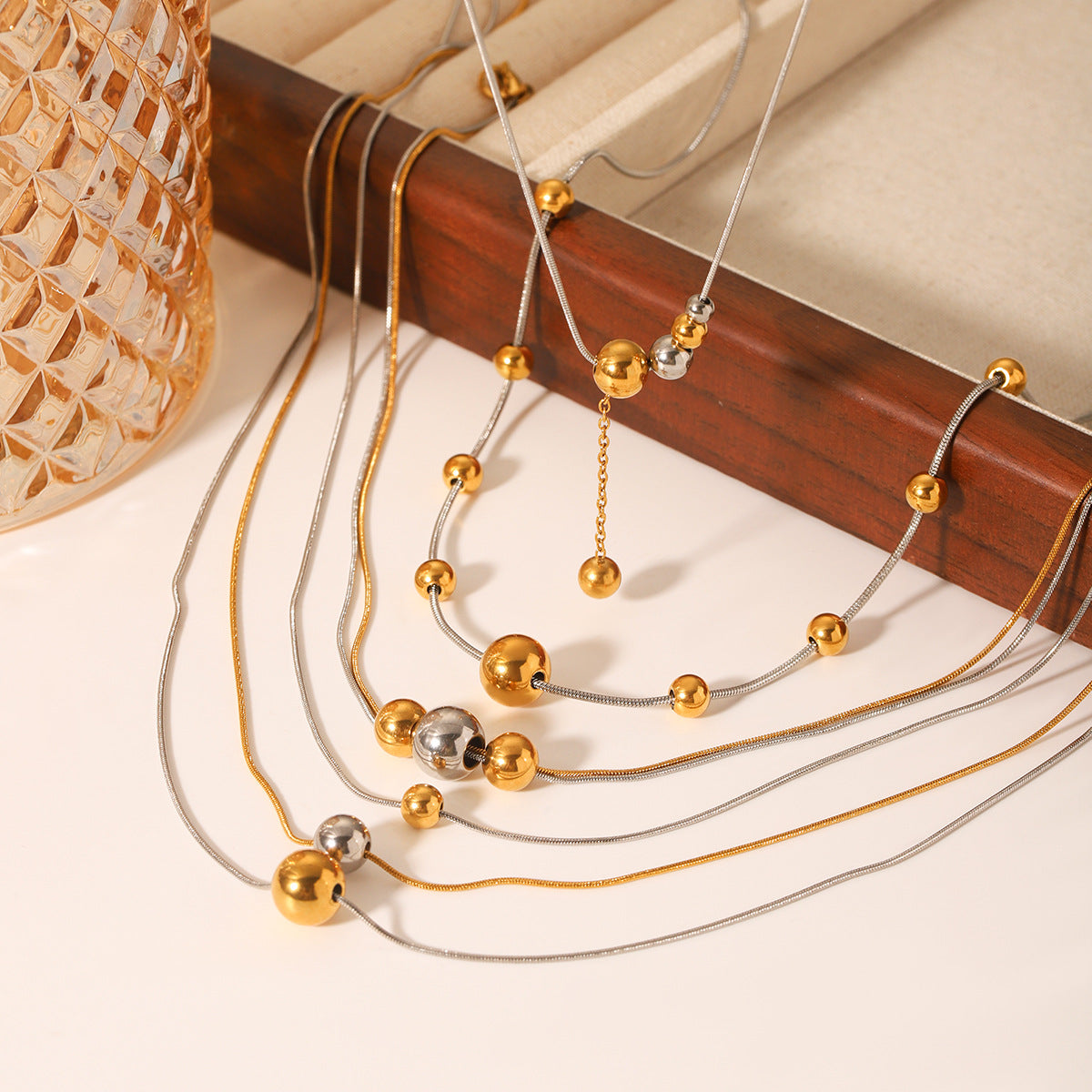 Minimalist Geometric Round Bead Pendant Necklace for Women in Stainless Steel with Titanium Steel Charm and Gold Plated Snake Chain
