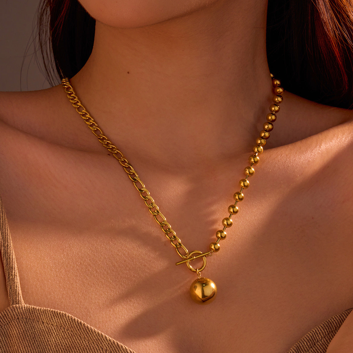 Collana da donna vintage in acciaio al titanio con perline tonde cave minimaliste e chiusura a moschettone