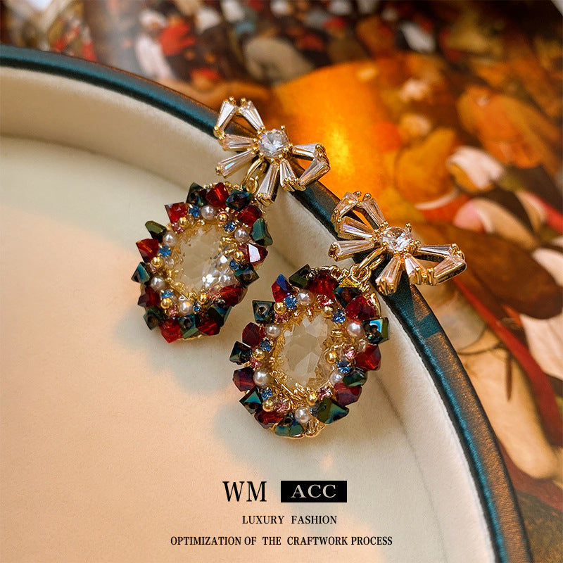 Elegantes pendientes de perlas y circonitas con forma ovalada y lazo en acero inoxidable para mujer