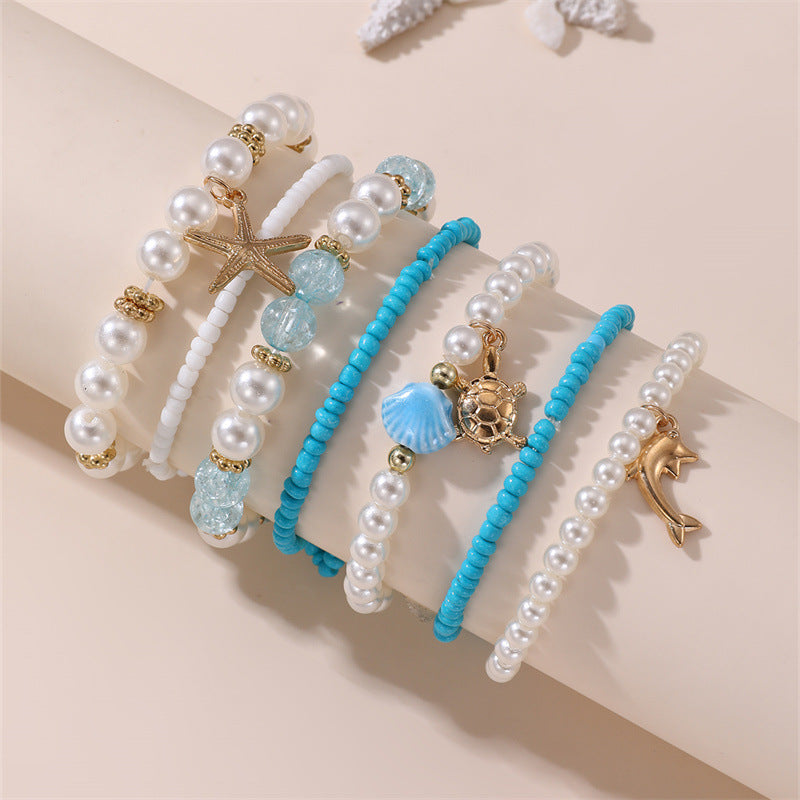 Pulsera de cristal con forma de estrella de mar, minimalista, para niñas, con acabado artesanal y diseño inspirado en el océano.