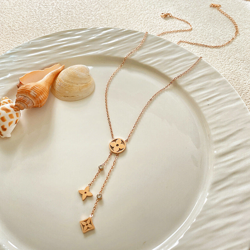 Minimalist Luxury Hollow Four-Leaf Clover Tassel Titanium Steel Necklace
