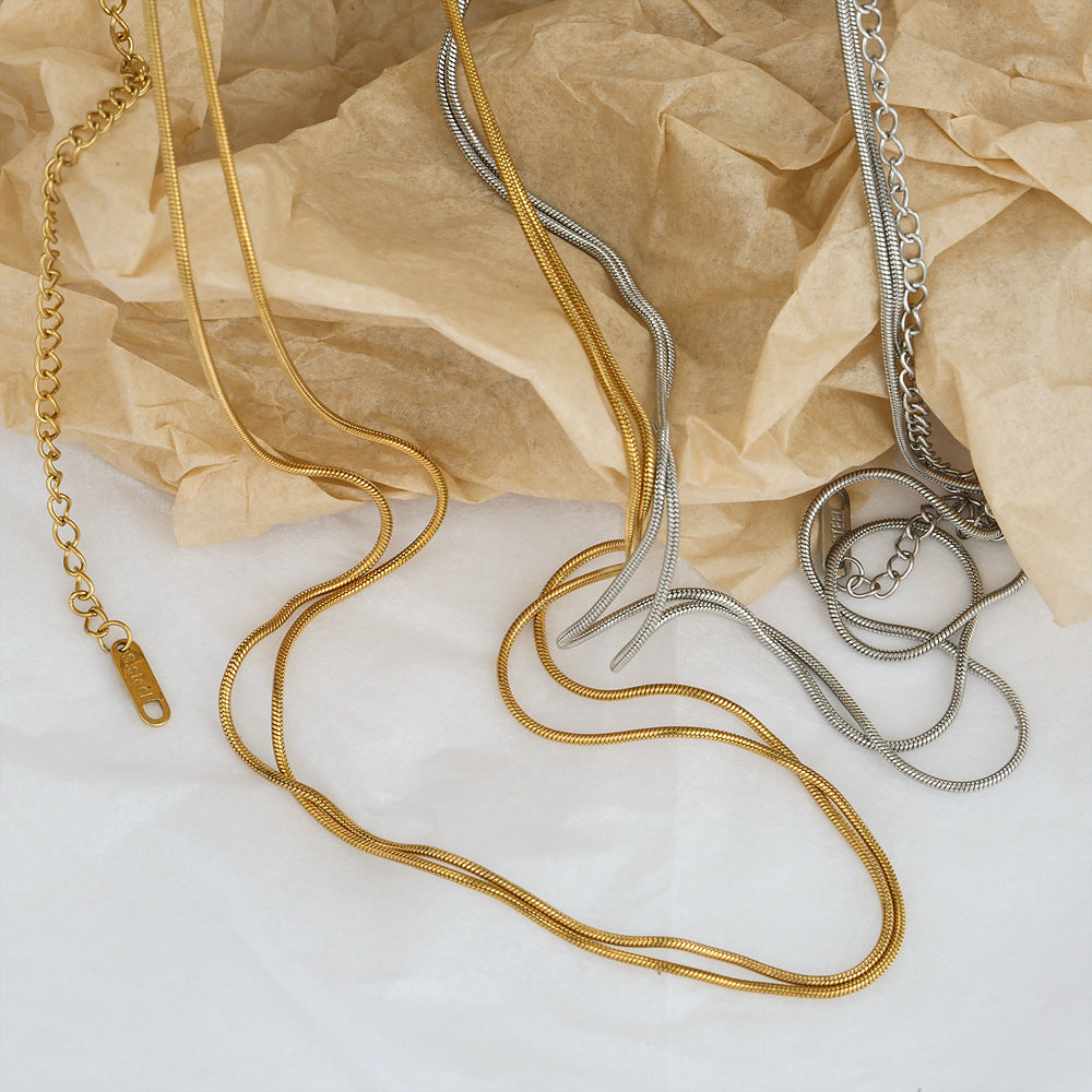 Cadena de cintura de doble capa de acero inoxidable con cadena de serpiente minimalista atrevida para mujer