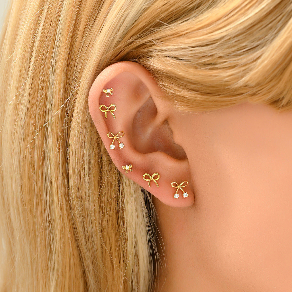 Pendientes rústicos de cobre en forma de lazo con circonitas cúbicas incrustadas para mujer