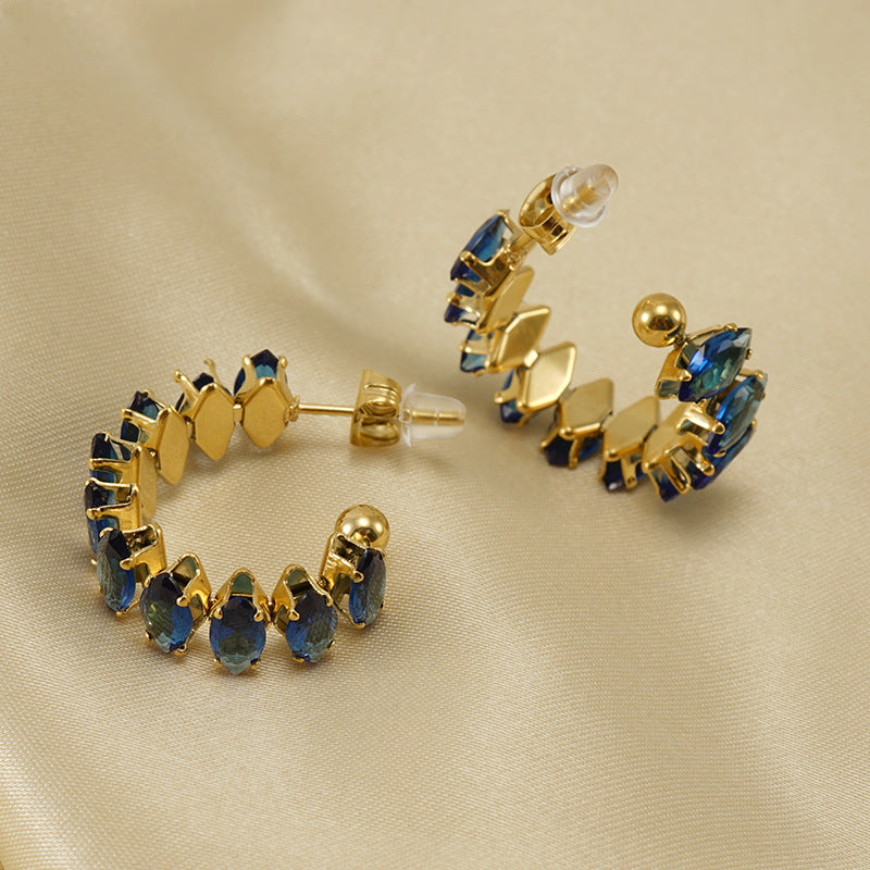 Orecchini a perno da donna alla moda geometrici in acciaio al titanio placcato oro 18K con zirconi