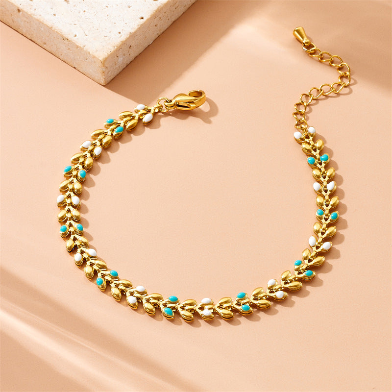 Bracciale da donna placcato oro minimalista in acciaio inossidabile con charm a foglia