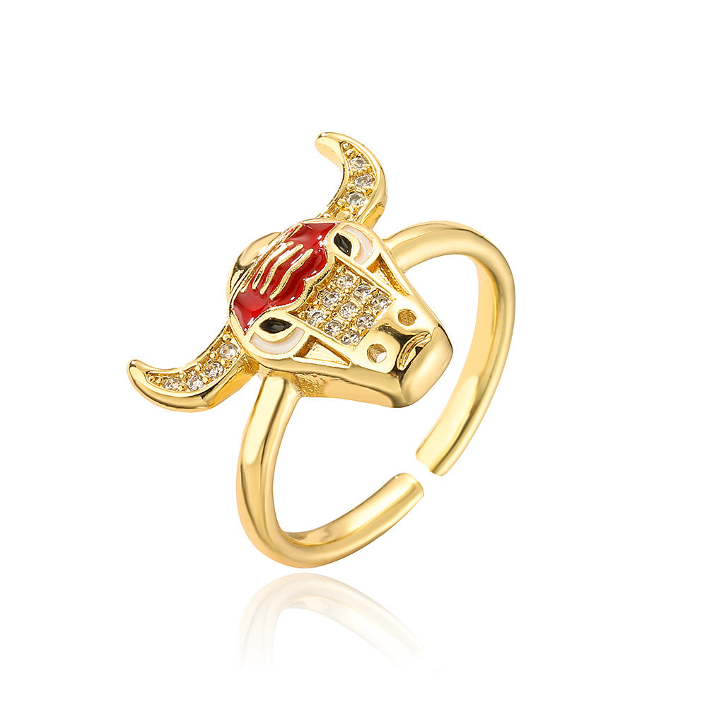 Anello geometrico aperto da donna con base in rame placcata in oro vero e testa di toro e design del pianeta in zircone micropavé
