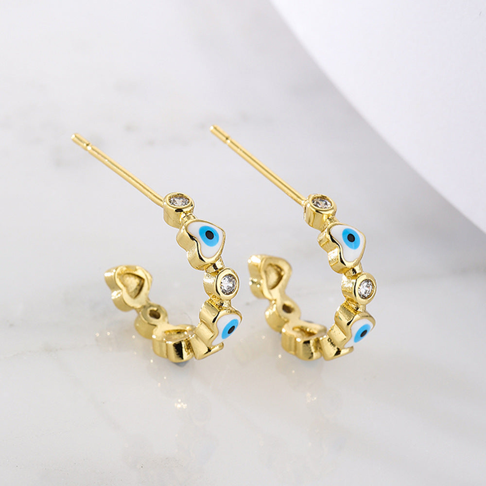 Geometric Style Copper Earrings with 18K Gold Plating and Micro-Paved Zirconia Heart-Eye C-Shaped Design for Women