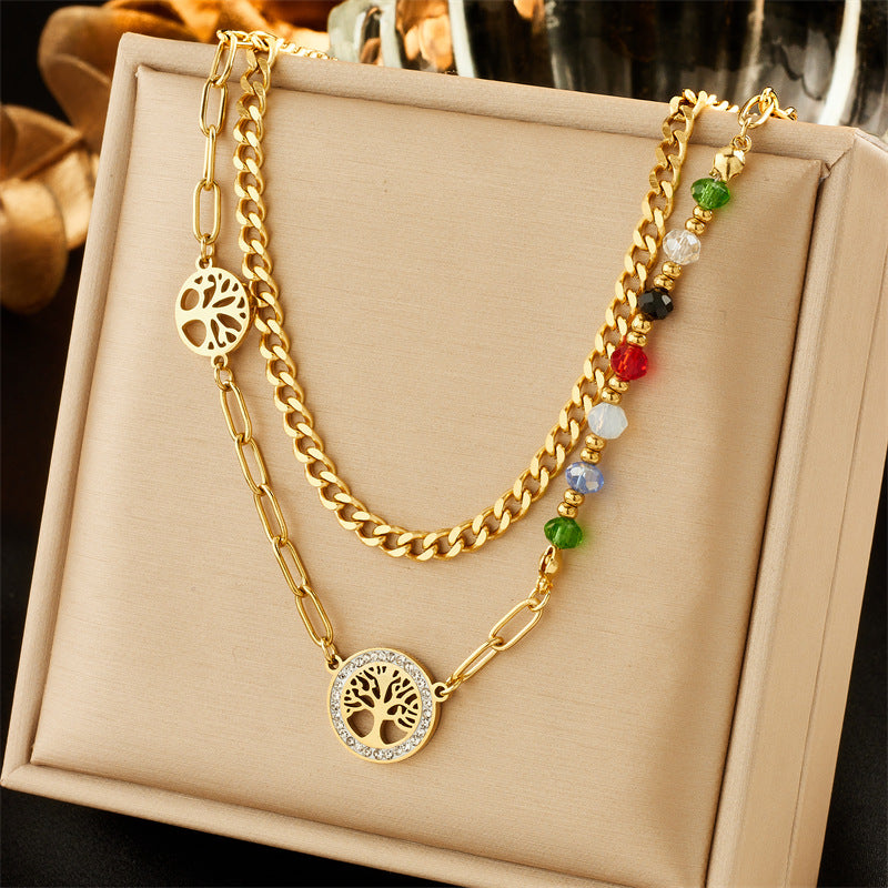 Collar con colgante minimalista de acero inoxidable con forma de corazón, incrustaciones de pedrería y cadena de cuentas de colores