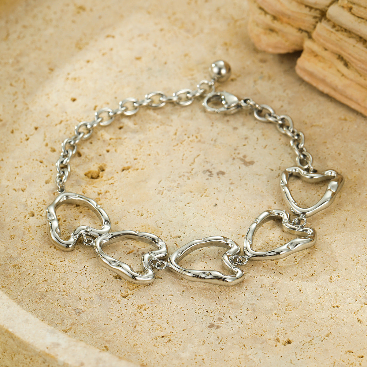 Minimalist Cool-Tone Irregular Hollow Heart OT Clasp Bracelet for Women Stainless Steel Plated Bracelet for Daily Wear and Office Use