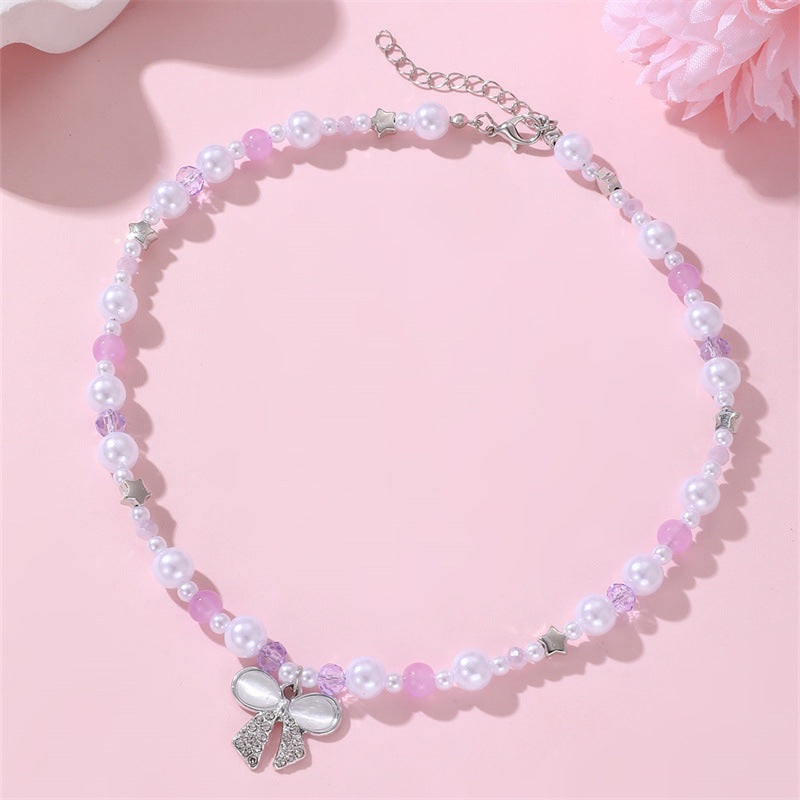 Set di collana per bambine a forma di fiocco minimalista in resina con braccialetto di perline per bambine dai 3 ai 10 anni