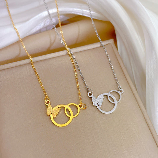 Collana con pendente a farfalla minimalista in acciaio al titanio da donna, con placcatura in oro e catena a medaglione dal design geometrico