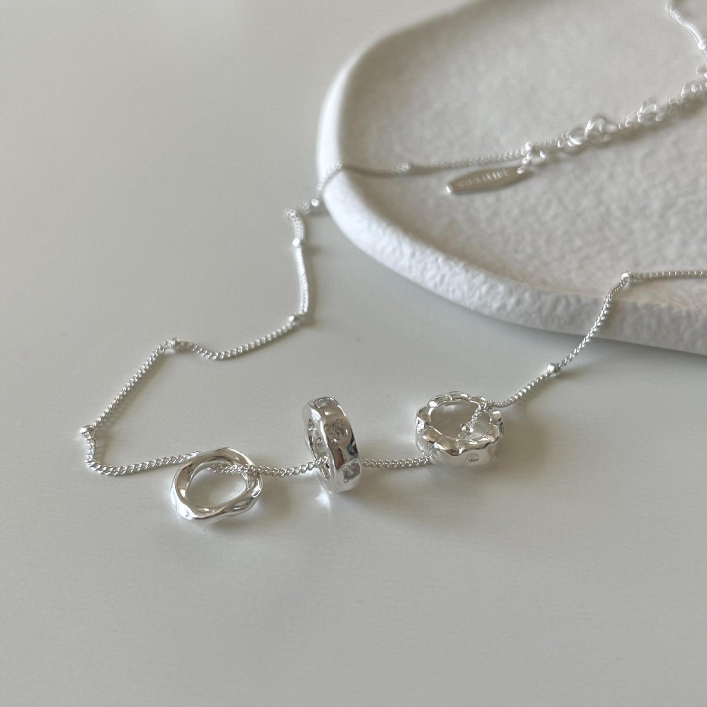Elegant French-Style Geometric Asymmetrical Zircon Pendant Necklace in 925 Sterling Silver with Water Texture and Natural Pattern
