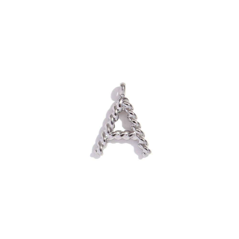 Colgante minimalista de acero inoxidable chapado en oro de 18 quilates con mini letra retorcida para mujer