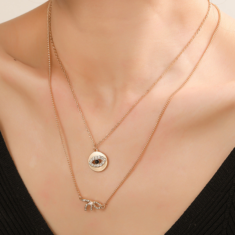 Sweet Rhinestone Inlaid Alloy Butterfly Evil Eye Bow Pendant Necklace with Curb Chain for Women