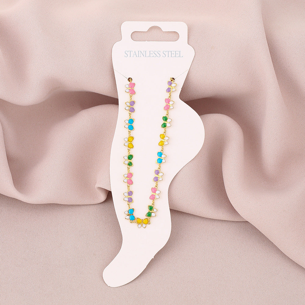 Elegante cavigliera da donna in acciaio al titanio a forma di farfalla con smalto, accessorio di moda dal design geometrico