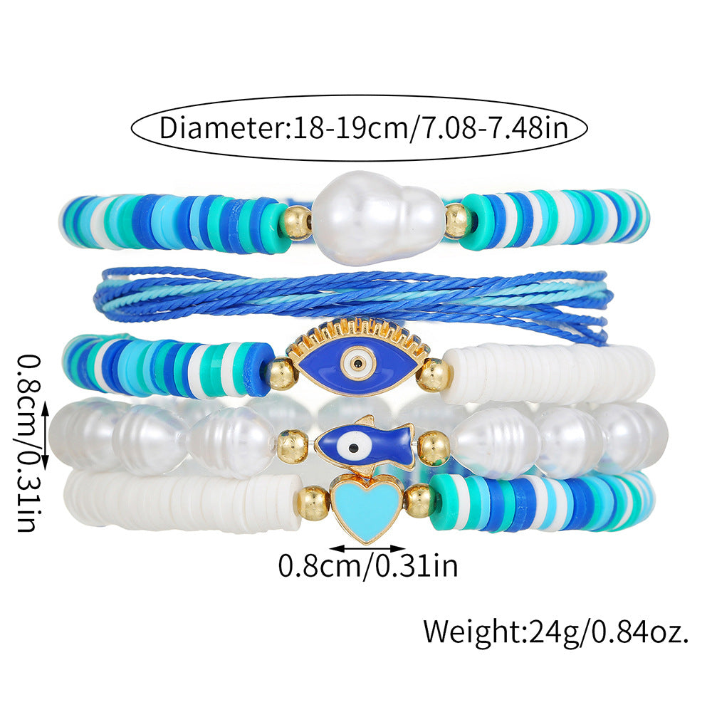 Braccialetto da donna dolce e carino a tema oceano in argilla polimerica e perle con pesci smaltati e occhi a forma di cuore