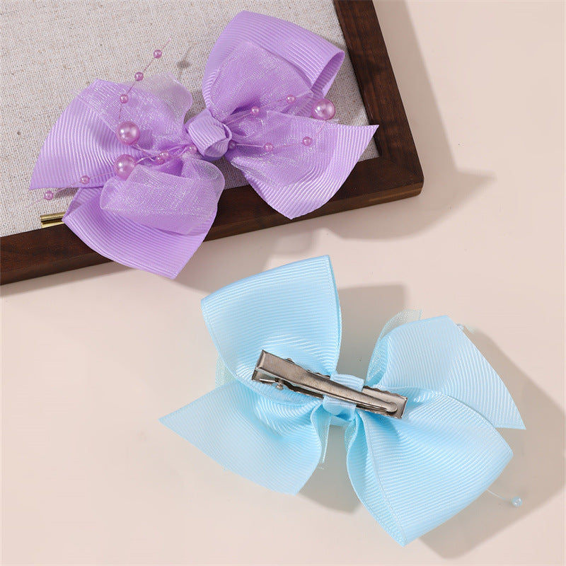 Graziosa molletta per capelli coreana per bambine con fiocco, design a rete arricciata 3D, forcina in resina plastica a becco d'anatra di colore rosa