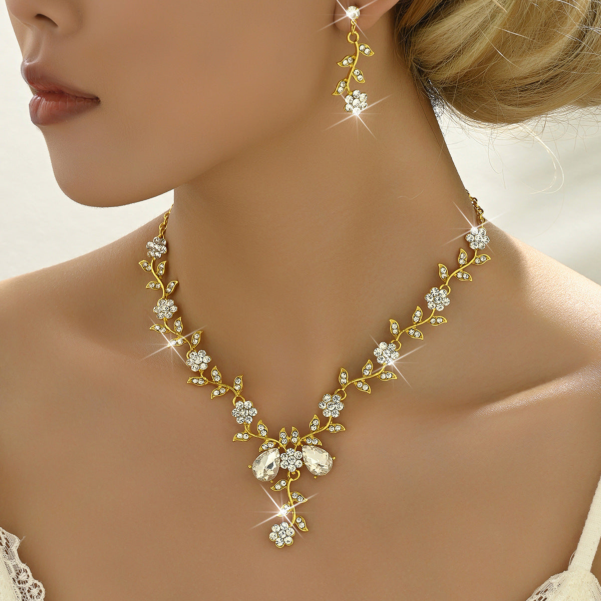 Exaggerated Floral Rhinestone and Crystal Necklace and Earring Set with Cross Chain