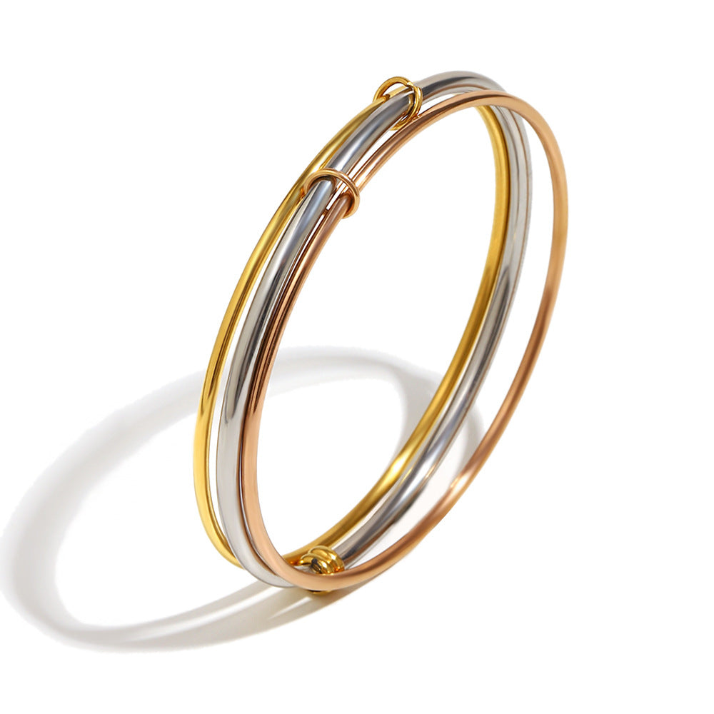 Pulsera Minimalista de Acero Inoxidable Enchapado en Oro de 18K con Tres Anillos de Colores Mezclados para Mujer