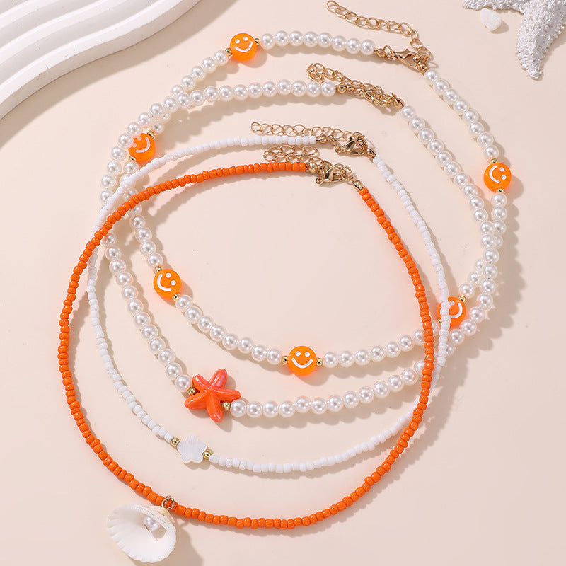 Collana Minimalista con Ciondolo a Fiocco a Farfalla per Bambini con Perline Rosa in Vetro su Catena di Perline Rotonde