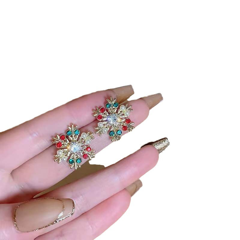 Pendientes de botón de aleación geométrica de copo de nieve de Navidad de moda para mujer con acabado chapado