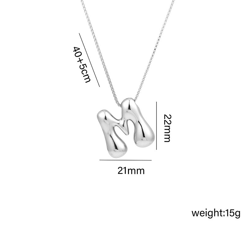 Collar con colgante de acero titanio con forma de letra minimalista y chapado en oro para mujer