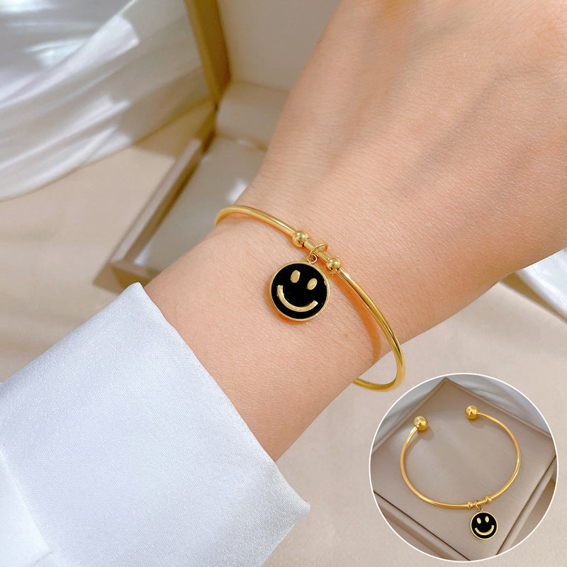 Bracciale Minimalista in Acciaio al Titanio con Faccina Sorridente in Madreperla e Finitura Placcata