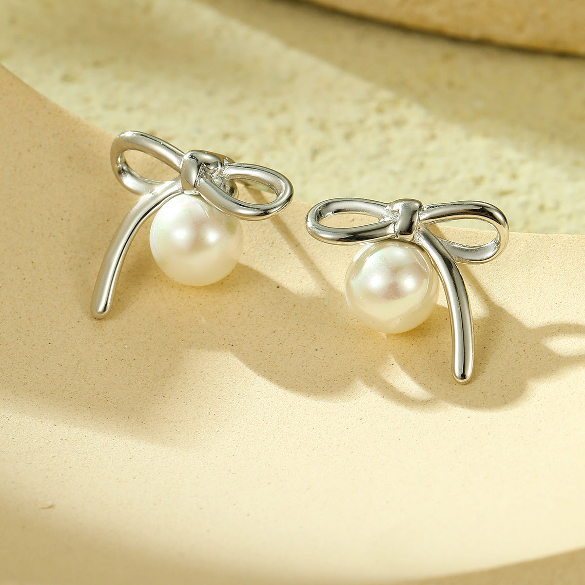 Minimalist Bow-Shaped Titanium Steel Stud Earrings with Pearl Inlay for Women, Hypoallergenic and Fade-Resistant