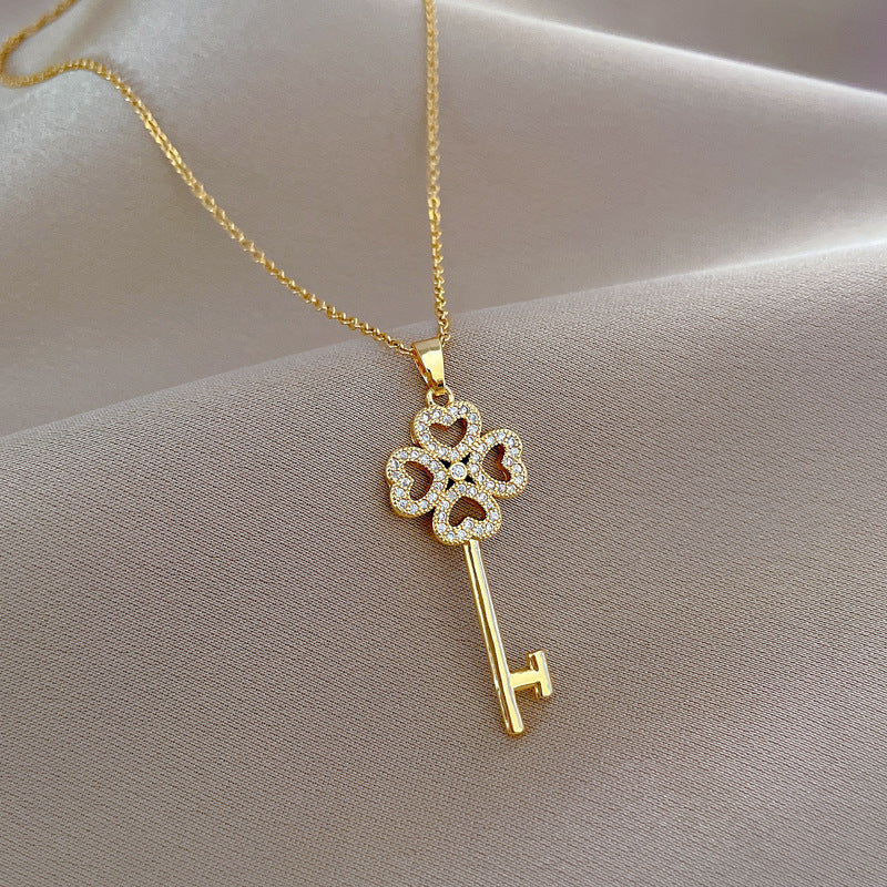 Collana con ciondolo di lusso quadrifoglio per donna e uomo, catena in acciaio al titanio con intarsio di strass, design geometrico
