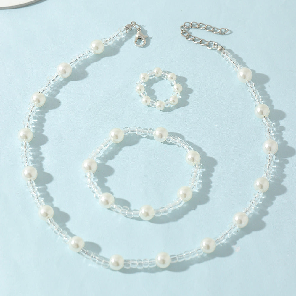 Juego de collar y pulsera de perlas con diseño de dibujos animados para niñas con cuentas de cristal transparente en un dulce y fresco diseño