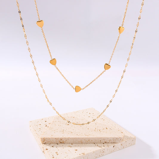 Collar minimalista con colgante de corazón de acero de titanio y cadena doble de acero inoxidable chapado en oro para mujer