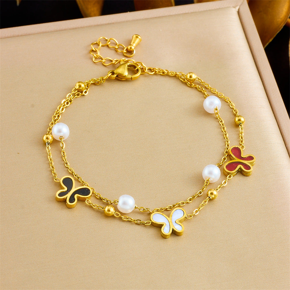 Bracciale minimalista da donna in acciaio inossidabile a forma di fiocco con placcatura in oro e inserti di perle